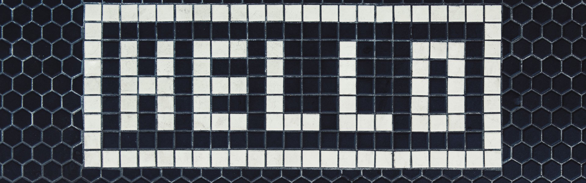 Hello spelled out in Tiles on a Hexagonal Tiled Floor