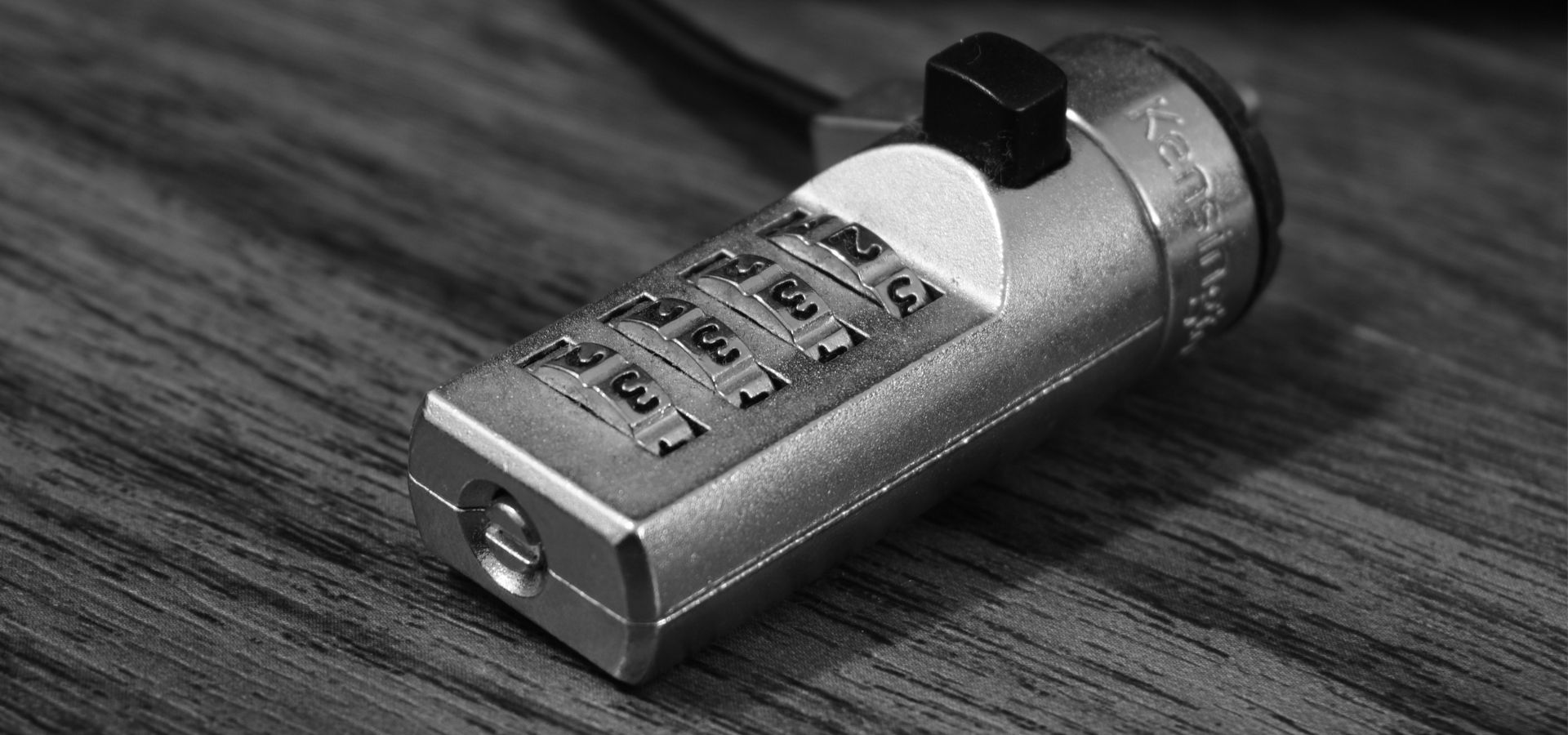 A combination lock laying on a table.